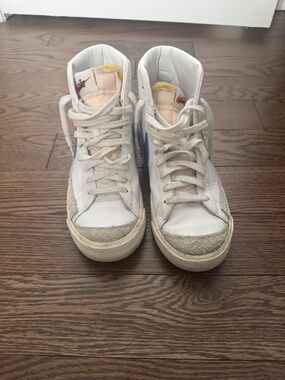 Nike White High-Top Sneakers with Blue Swoosh